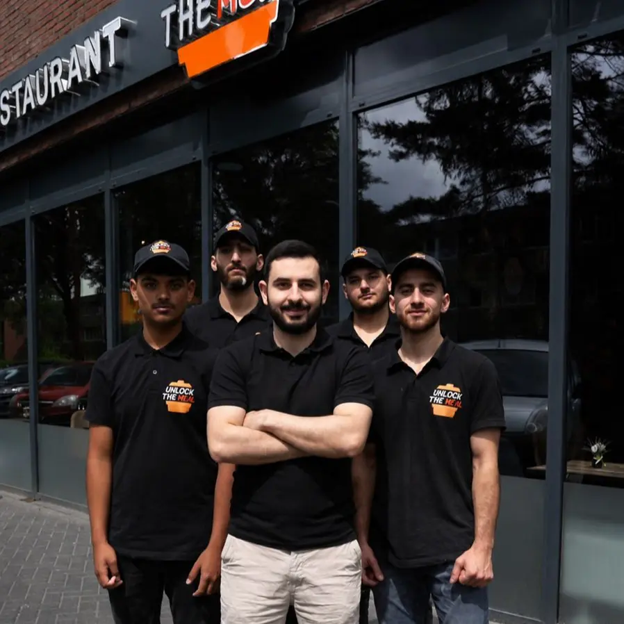 The Unlock The Meal team in front of the restaurant